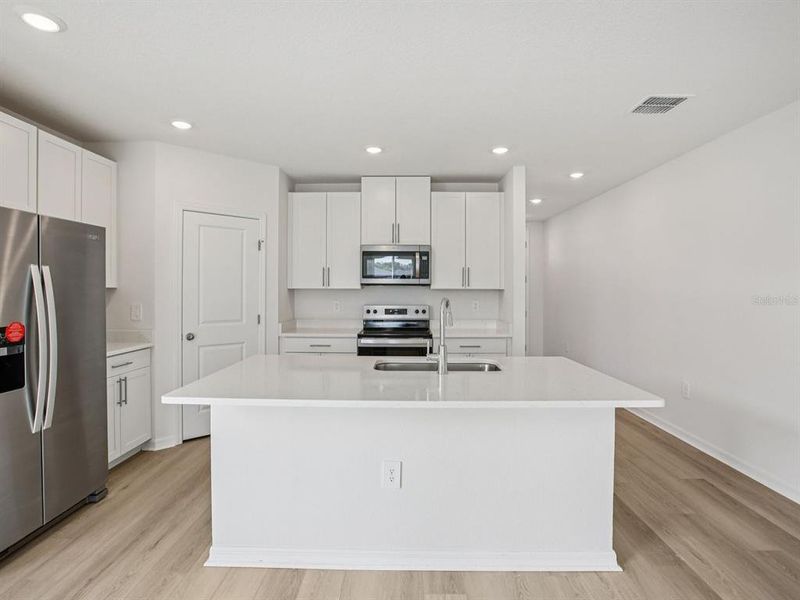 Furnished interior view inside a new home in The Grove at Stuart Crossing - Classic Series, Bartow (Image 10).
