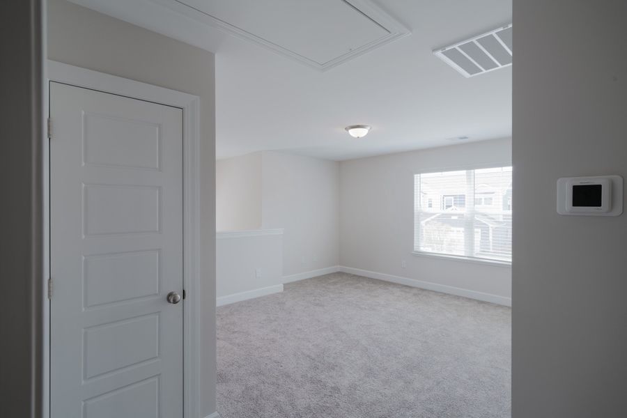 Representative unfurnished interior of a home built from the The Holland by Cothran Homes in Holly Ridge, Greenville (Image 31).