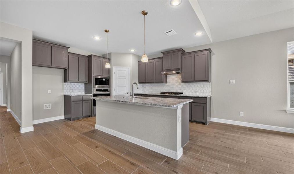 Kitchen-All Home and community information, including pricing, included features, terms, availability and amenities, are subject to change at any time without notice or obligation. All Drawings, pictures, photographs, video, square footages, floor plans, elevations, features, colors and sizes are approximate for illustration purposes only and will vary from the homes as built.