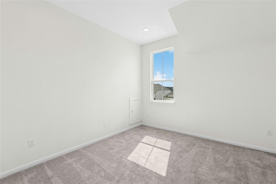 Empty room featuring carpet floors and baseboards Empty room featuring carpet floors and baseboards