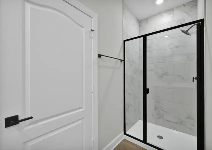 The master bathroom also includes a walk-in shower
