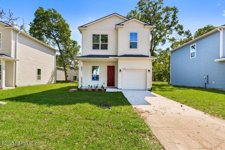 Front exterior of a new home in , Jacksonville, FL, highlighting curb appeal (Image 1). Front exterior of a new home in , Jacksonville, FL, highlighting curb appeal (Image 1).