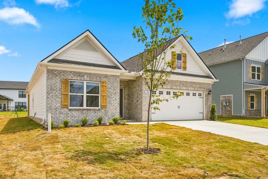 Front exterior of a new home in The Oaks, Clarksville, TN, highlighting curb appeal (Image 16).
