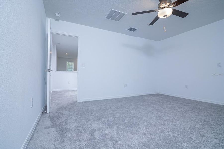 Spacious, unfurnished interior of a new home in Saddle Creek Preserve: The Manors II, Lakeland (Image 21).