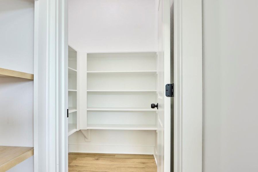 Spacious walk in pantry. Spacious walk in pantry.