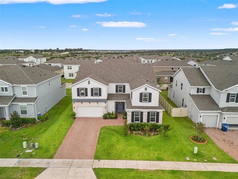 Front exterior of a new home in , Minneola, FL, highlighting curb appeal (Image 1). Front exterior of a new home in , Minneola, FL, highlighting curb appeal (Image 1).