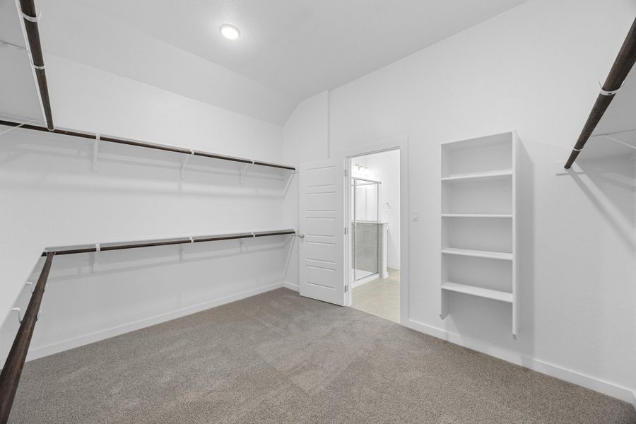 Primary Closet in the Pecan II home plan by Trophy Signature Homes – REPRESENTATIVE PHOTO Primary Closet in the Pecan II home plan by Trophy Signature Homes – REPRESENTATIVE PHOTO
