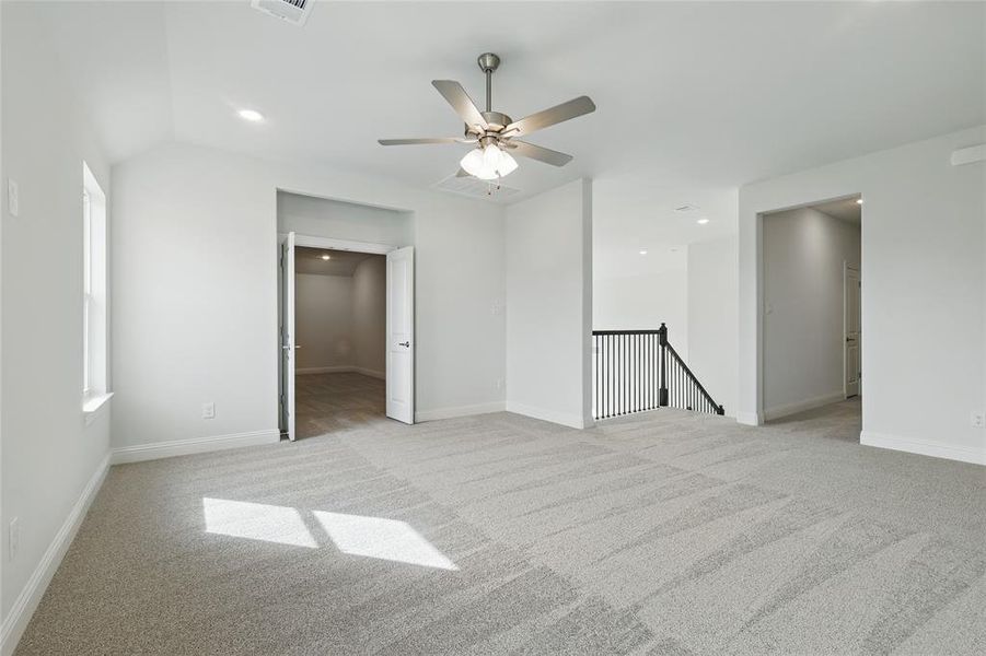 Unfurnished room with recessed lighting, ceiling fan, light carpet, and baseboards Unfurnished room with recessed lighting, ceiling fan, light carpet, and baseboards