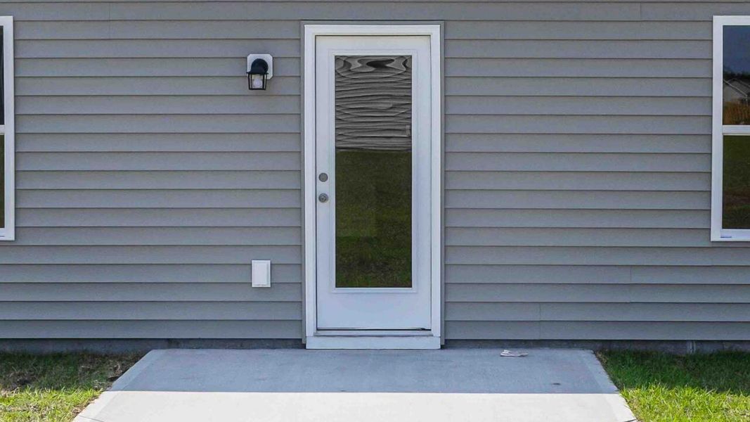Representative exterior photo of a completed home built from the Devon by D.R. Horton in Eagle Creek, Bolivia, NC (Image 17).