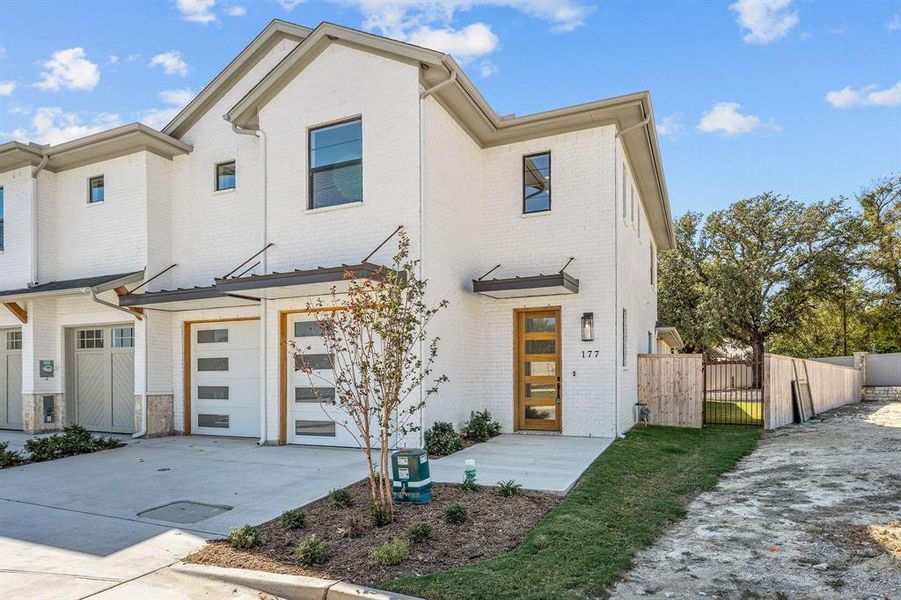 Front exterior of a new home in , Aledo, TX, highlighting curb appeal (Image 2).