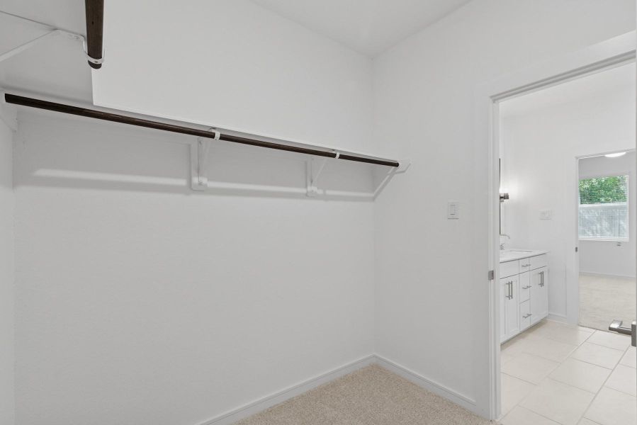 Walk-in closet in the primary suite Walk-in closet in the primary suite