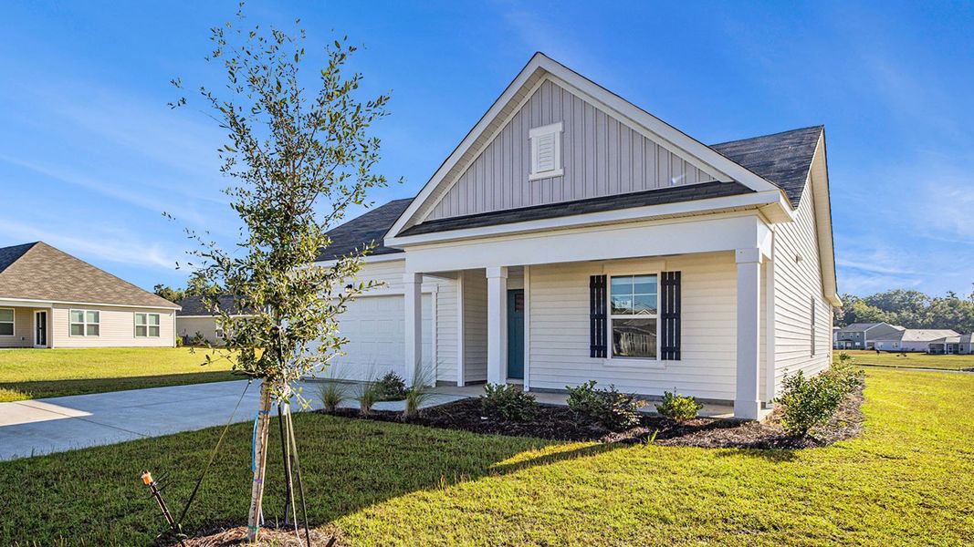 Front exterior of a new home in Dove Crossing, Conway, SC, highlighting curb appeal (Image 21).