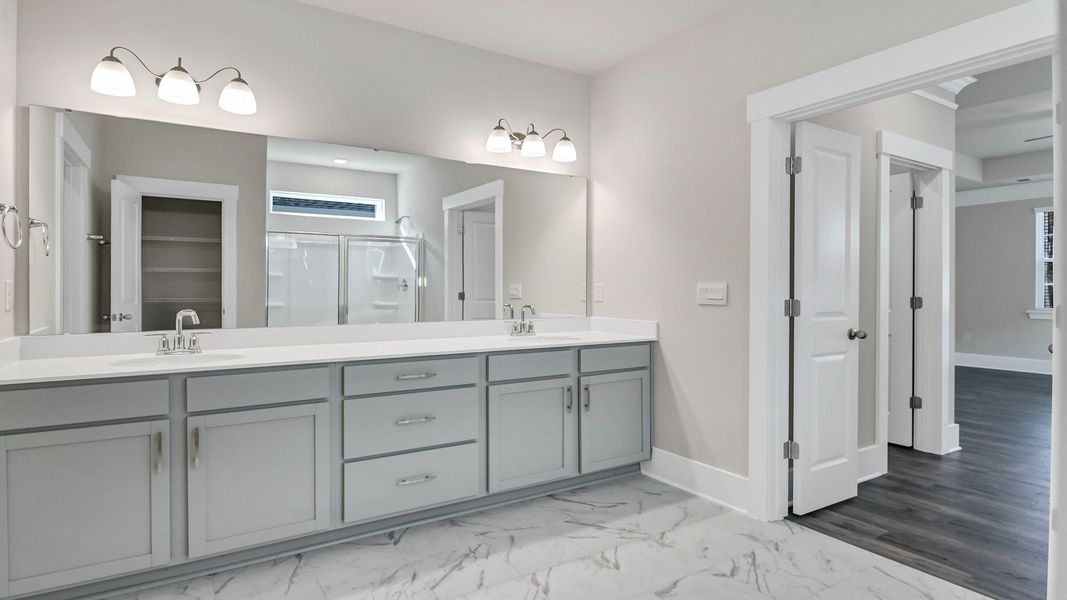 Representative furnished interior of a home built from the Litchfield by D.R. Horton in Lake Tide Summit, Chapin (Image 14).