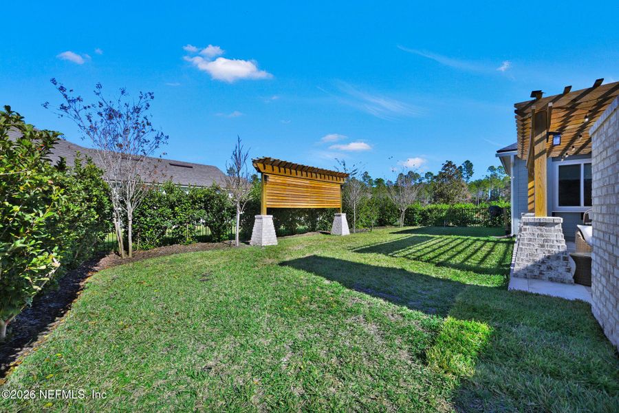 Exterior details and patio area of a home in Palmetto Cove, Ponte Vedra (Image 25).
