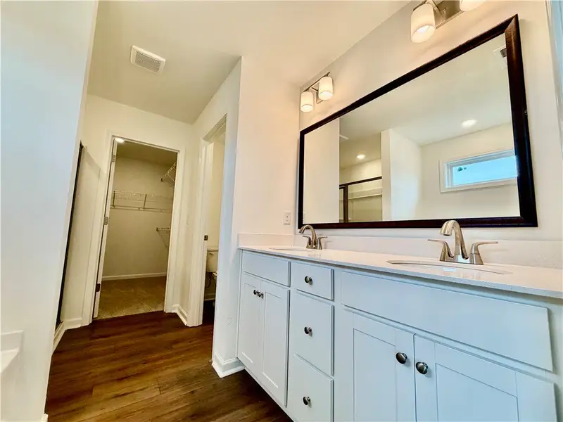 A spacious double vanity anchors this modern bathr