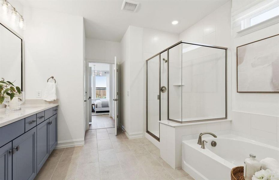 Modern owner's bath with dual vanities and a spacious shower *Model representation Modern owner's bath with dual vanities and a spacious shower *Model representation