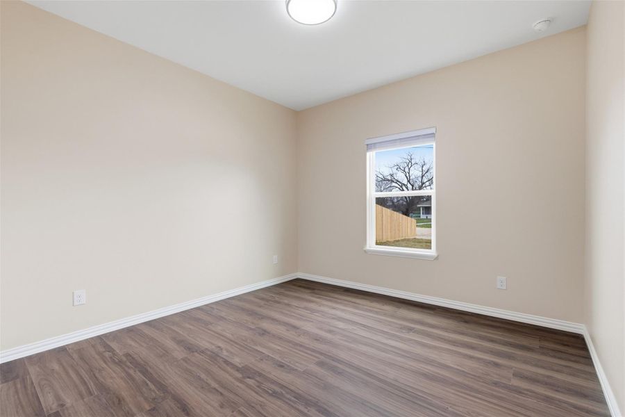 Unfurnished room with wood finished floors