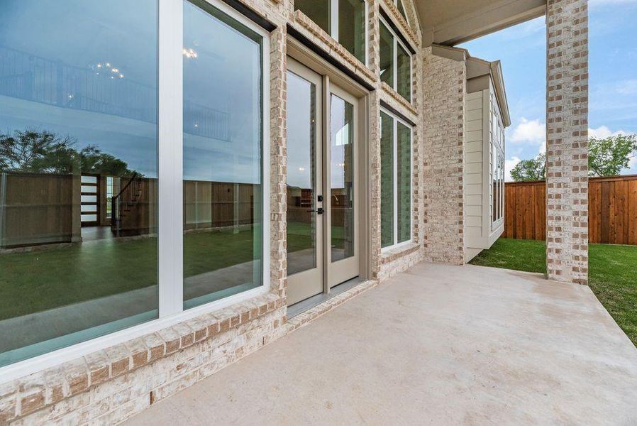 Exterior details and patio area of a home in Grand Estates of Anna, Anna (Image 22).
