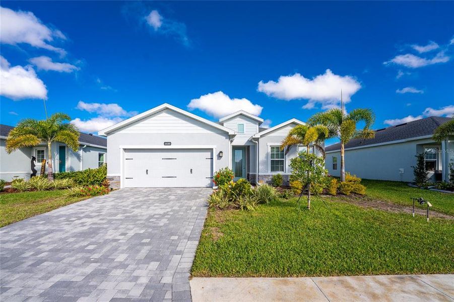 Front exterior of a new home in , Port Charlotte, FL, highlighting curb appeal (Image 24).