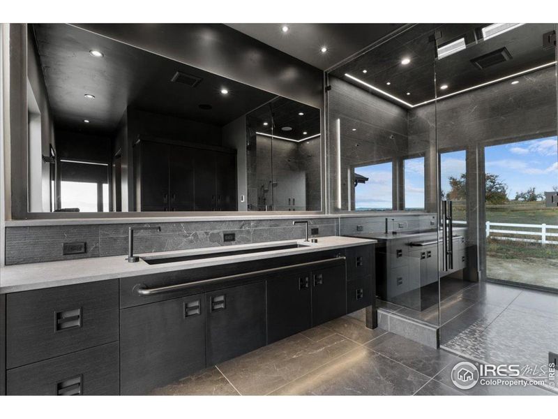 Primary Bathroom w/ heated floors, custom cabinetry, accent lighting, and more