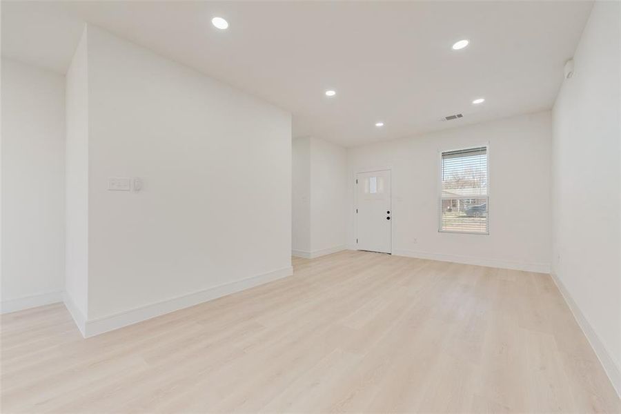 Empty room featuring light hardwood / wood-style flooring