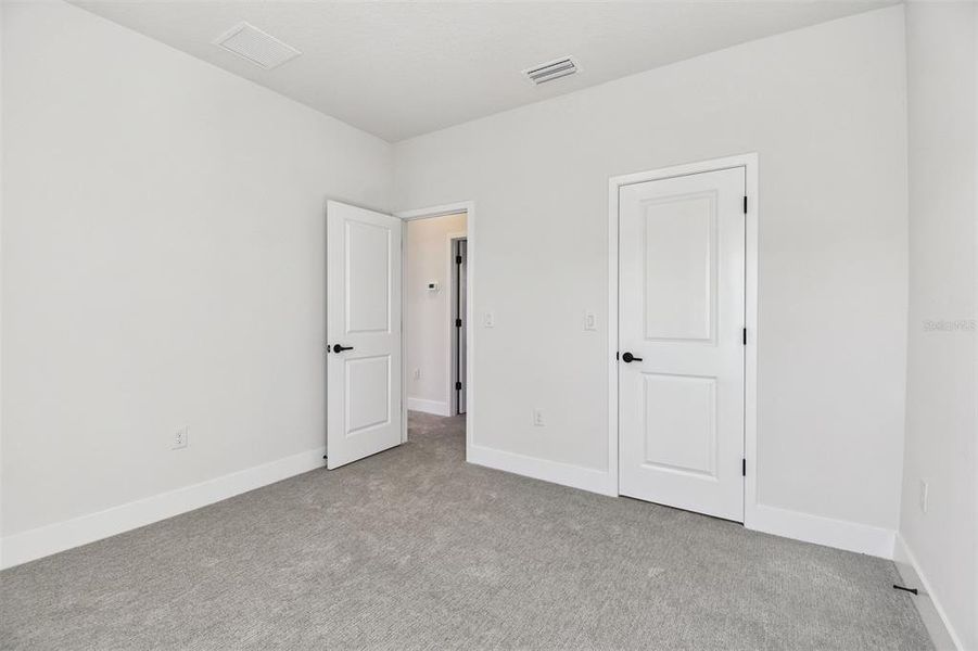 Spacious, unfurnished interior of a new home in Emerald Landing at Waterside at Lakewood Ranch – Cottage Series, Sarasota (Image 22).