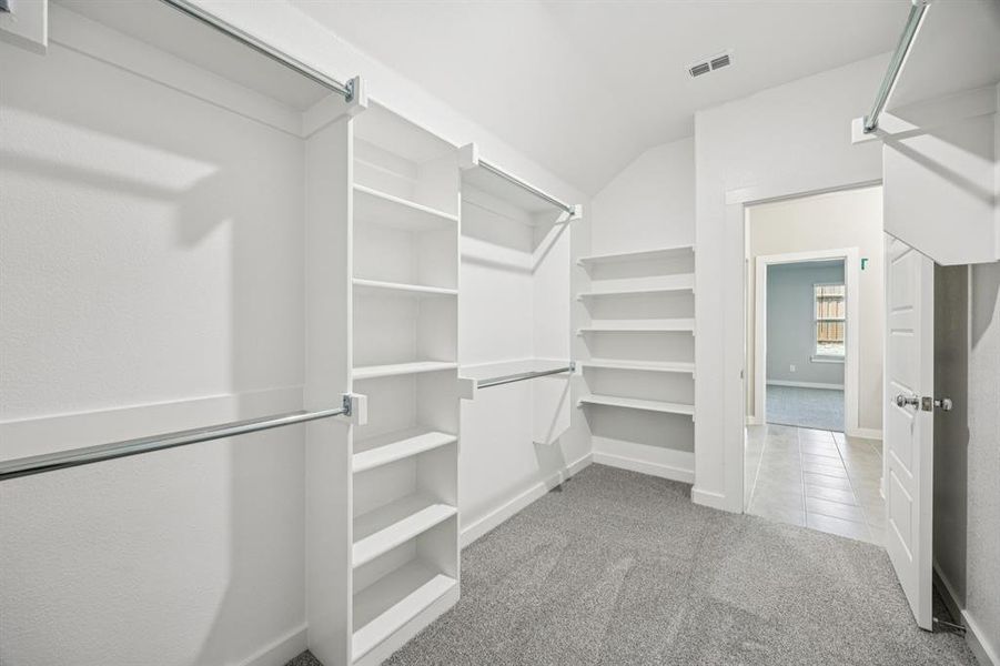 Primary Closet in the Oscar home plan by Trophy Signature Homes – REPRESENTATIVE PHOTO Primary Closet in the Oscar home plan by Trophy Signature Homes – REPRESENTATIVE PHOTO