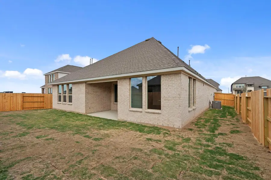 Exterior details and patio area of a home in Sunterra Lakes, Brookshire (Image 3).