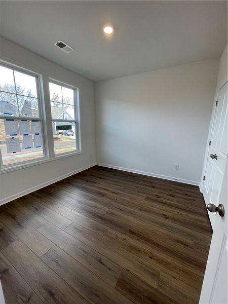 This bright room features durable flooring and amp