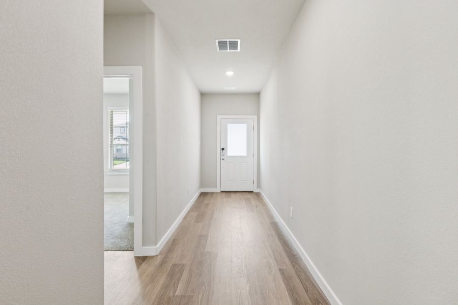 Entryway in the Stanley II home plan by Trophy Signature Homes – REPRESENTATIVE PHOTO