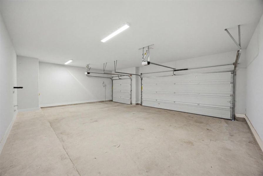 Secure parking is readily available in this generously proportioned garage with multiple doors.