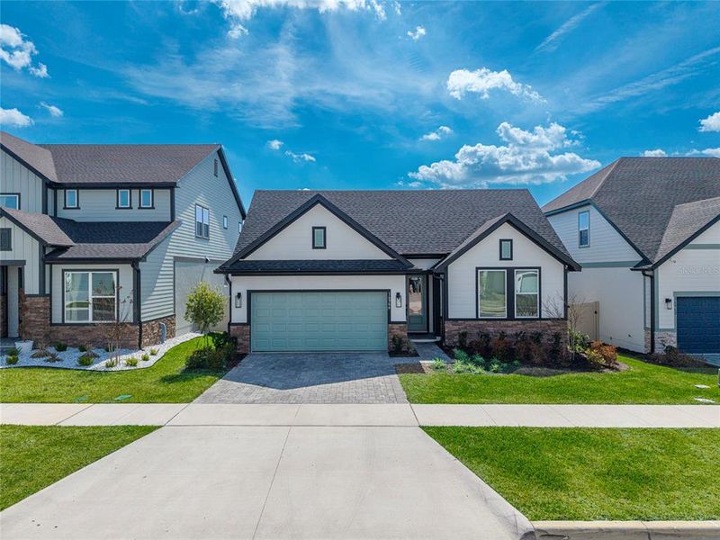 Front exterior of a new home in , Clermont, FL, highlighting curb appeal (Image 1). Front exterior of a new home in , Clermont, FL, highlighting curb appeal (Image 1).