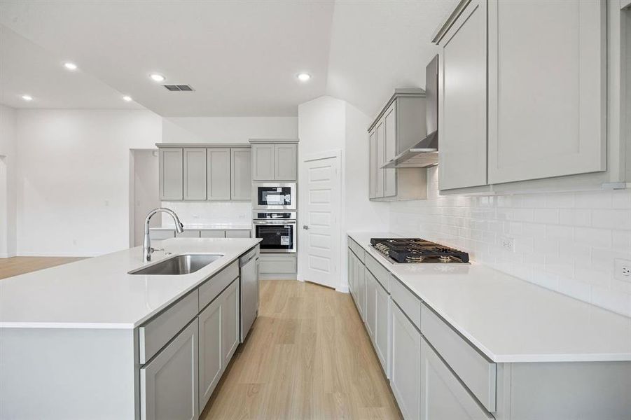 Kitchen in the Gilmour II home plan by Trophy Signature Homes – REPRESENTATIVE PHOTO Kitchen in the Gilmour II home plan by Trophy Signature Homes – REPRESENTATIVE PHOTO