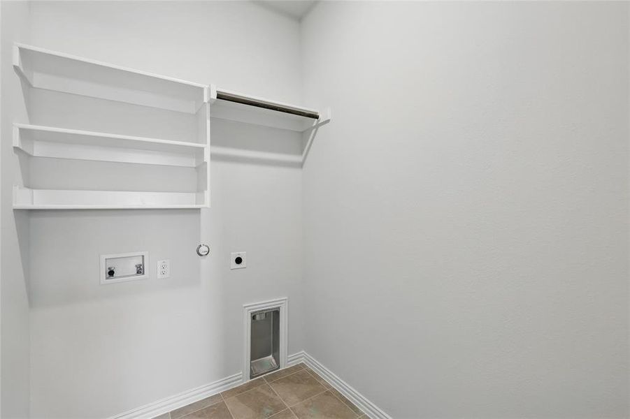 Laundry area featuring hookup for a gas dryer, hookup for an electric dryer, and washer hookup