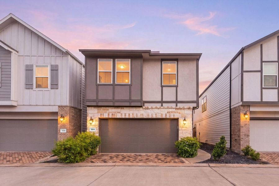 Front exterior of a new home in Dunvale Village - Townhome Collection, Houston, TX, highlighting curb appeal (Image 1). Front exterior of a new home in Dunvale Village - Townhome Collection, Houston, TX, highlighting curb appeal (Image 1).
