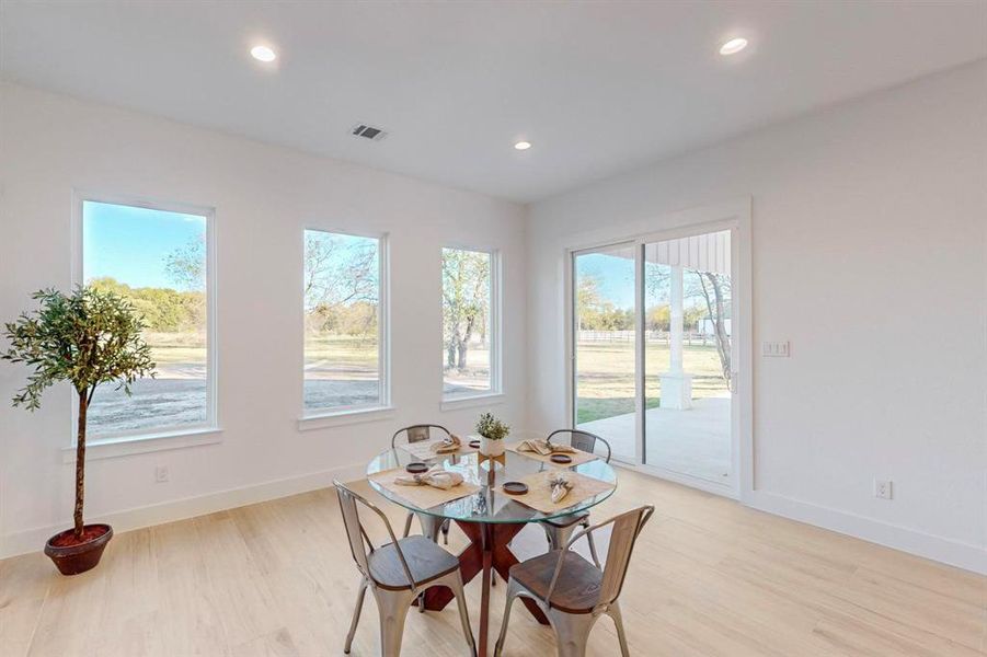 Dining space with light wood-type flooring