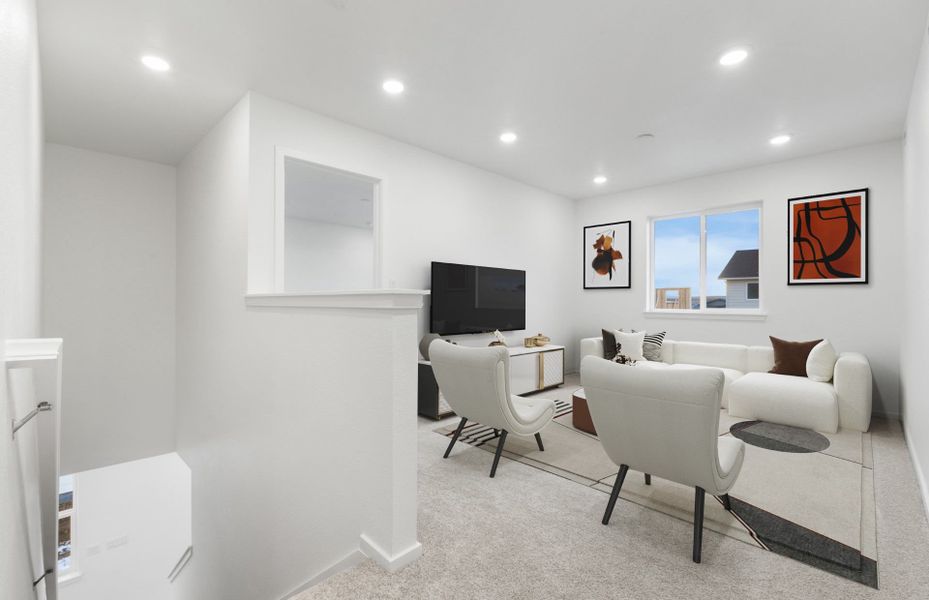 Representative furnished interior of a home built from the Caroline by Pulte Homes in Strata, Dacono (Image 3).