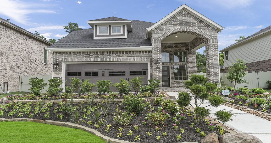 Front exterior of a new home in Wood Leaf Reserve, Tomball, TX, highlighting curb appeal (Image 22).