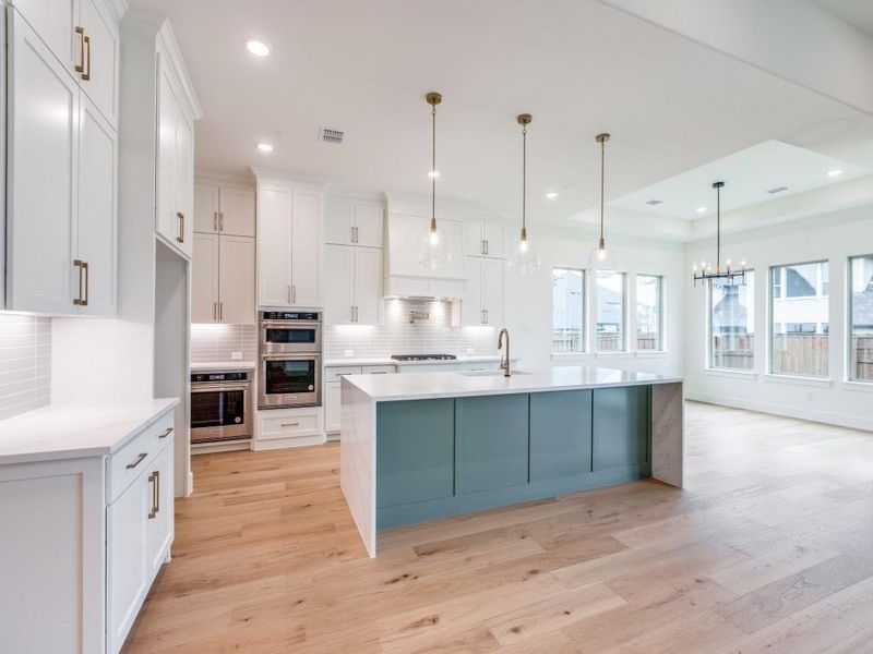 You'll find top of the line appliances, a gorgeous backsplash and beautiful hardware in this lovely kitchen.