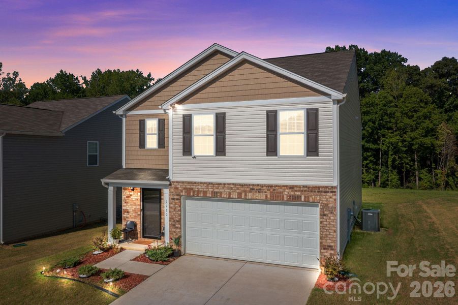 Front exterior of a new home in Mills at Long Creek, Dallas, NC, highlighting curb appeal (Image 21).