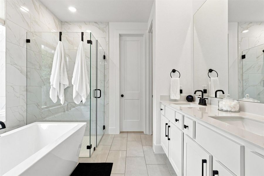 Clean lines and a freestanding tub define this contemporary primary bath.