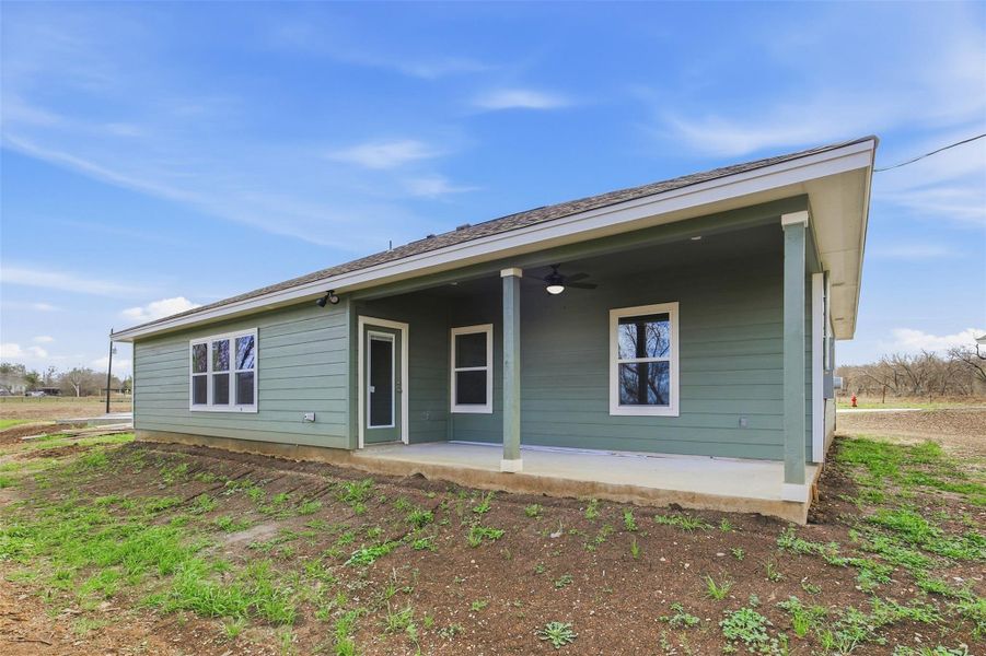 A well-lit rear covered porch, perfect for enjoying outdoor moments.