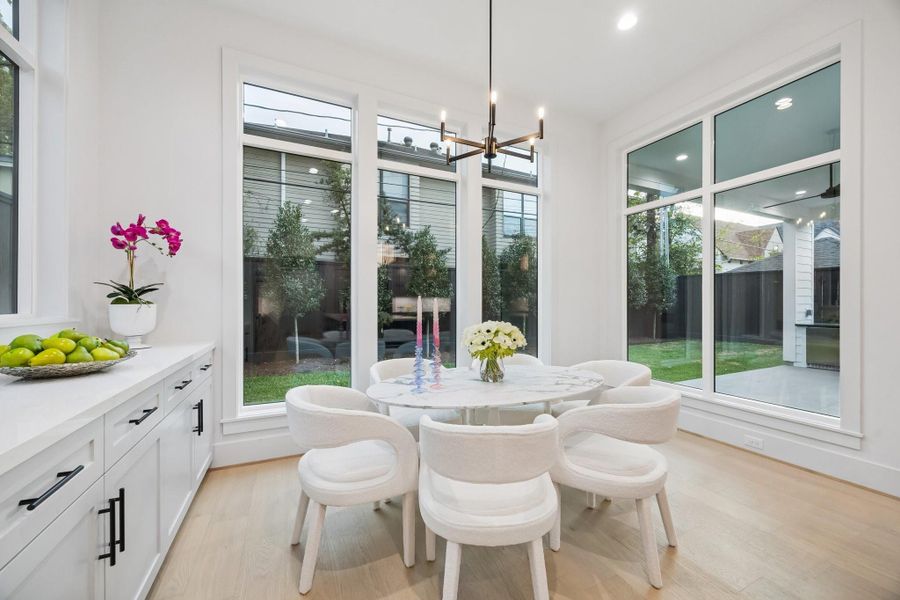 Another view of the Breakfast Area with views of the Covered Lanai and Back Yard.