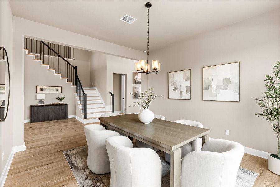 The dining area features a beautiful neutral color palette, perfect for dinner parties or intimate gatherings. *Virtually Staged*