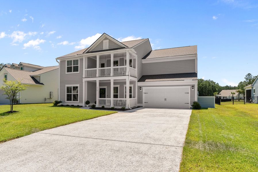 Front exterior of a new home in Sea Island Preserve, Johns Island, SC, highlighting curb appeal (Image 27). Front exterior of a new home in Sea Island Preserve, Johns Island, SC, highlighting curb appeal (Image 27).
