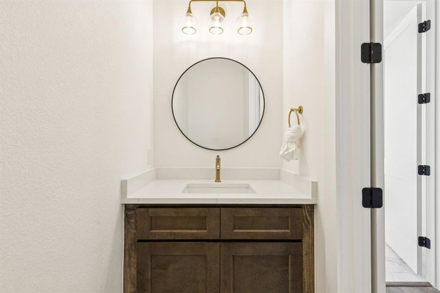 Half Bath with Rich Wood Cabinets
