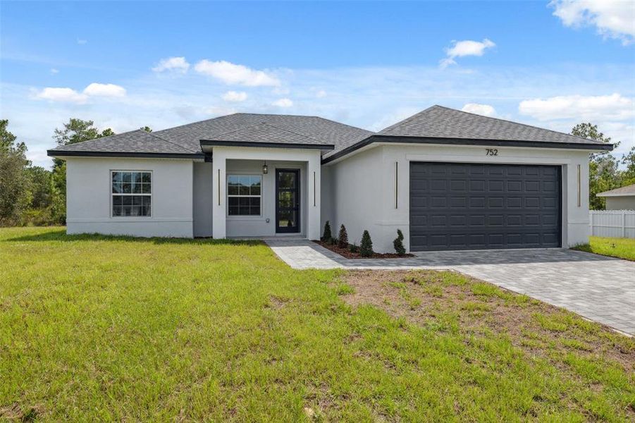 Front exterior of a new home in , Ocala, FL, highlighting curb appeal (Image 24).