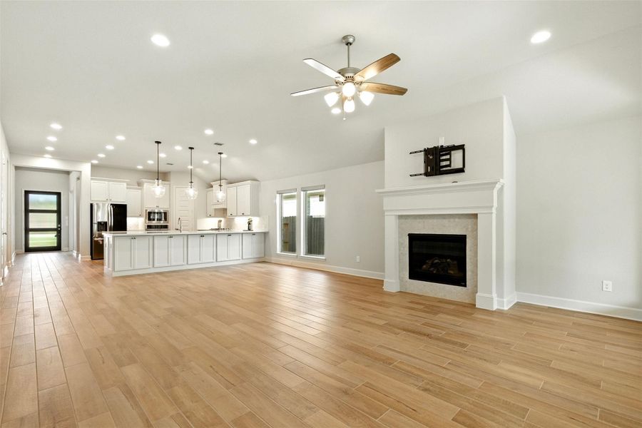 Living room features a gas log fireplace. Living room features a gas log fireplace.