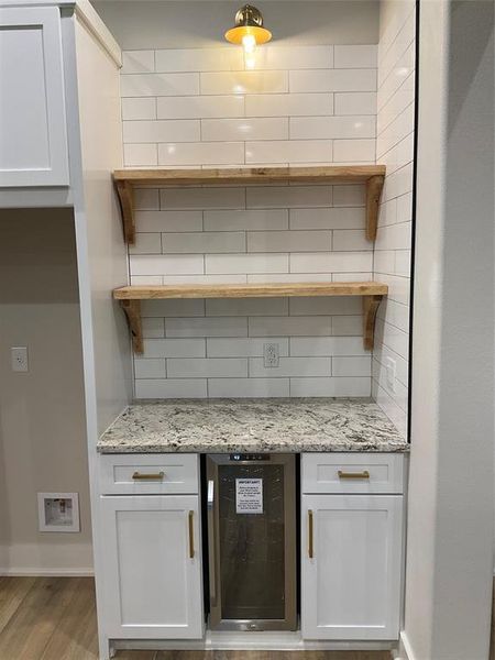 Bar area in kitchen with wine fridge