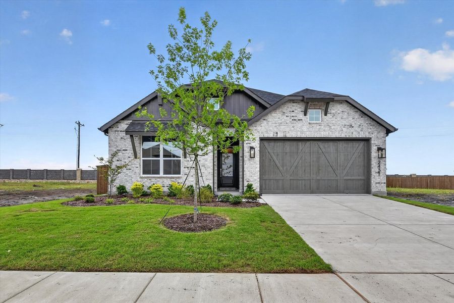 Front exterior of a new home in Sonoma Verde, McLendon-Chisholm, TX, highlighting curb appeal (Image 1). Front exterior of a new home in Sonoma Verde, McLendon-Chisholm, TX, highlighting curb appeal (Image 1).